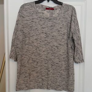 Cyrus tan and black top with button detailing on the back side